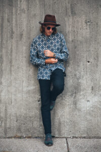 Young man in matching outfit with sneakers